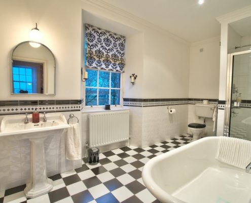Ensuite bathroom with bath and drenching shower